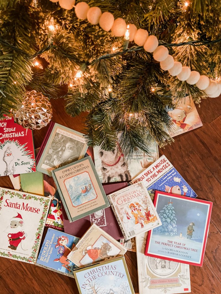 Christmas books under decorated tree