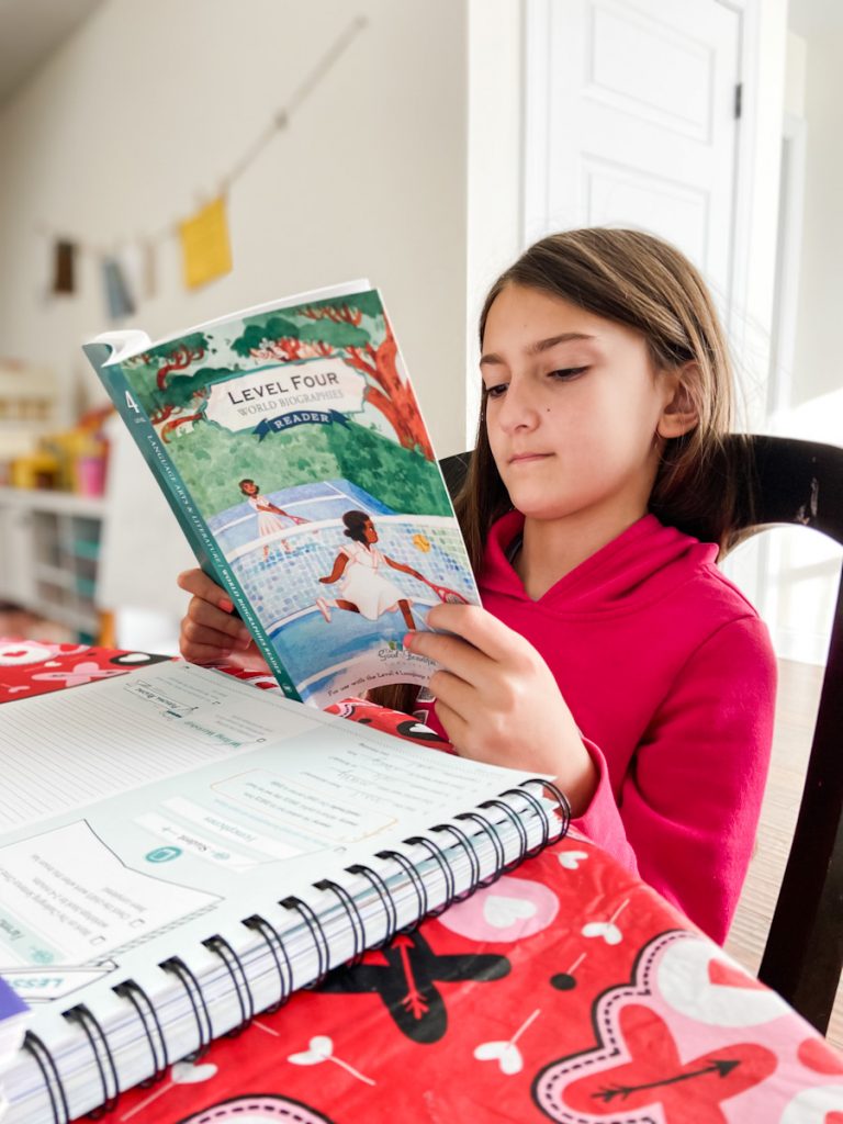 girl reading at a table