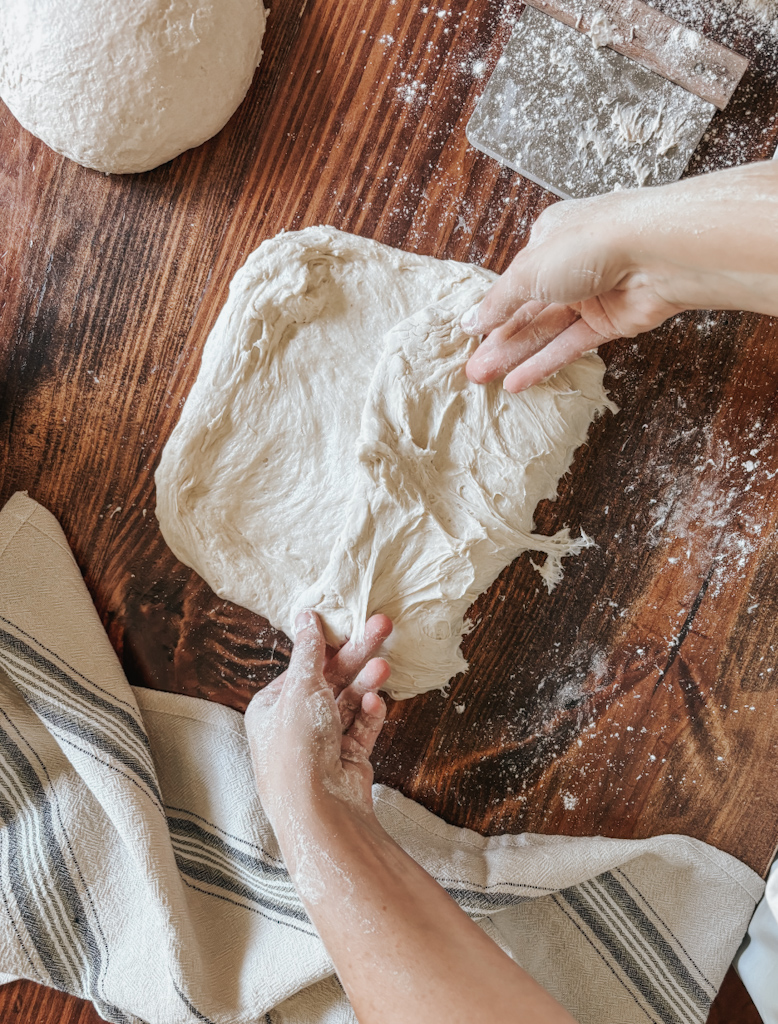 shaping sourdough bread by folding