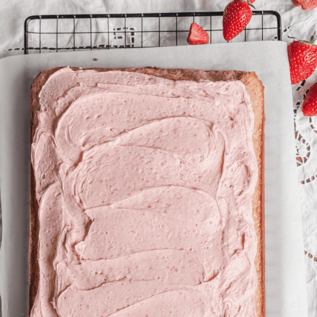 overhead view sheet cake with strawberry frosting