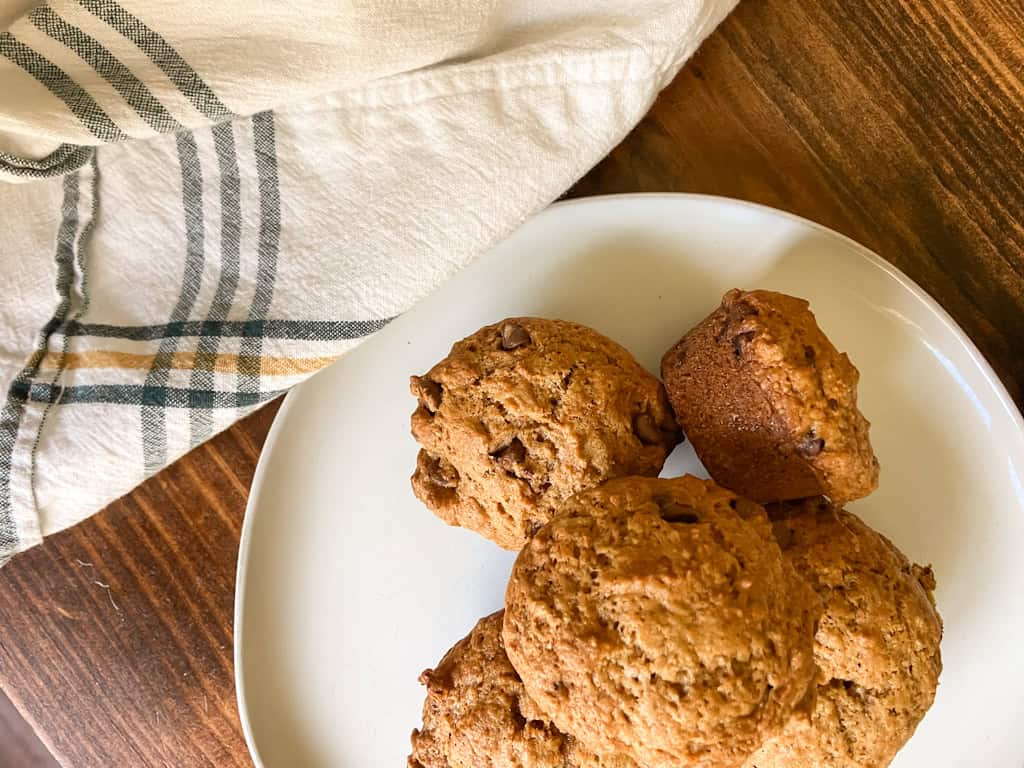 sourdough pumpkin chocolate chip muffins on a plate