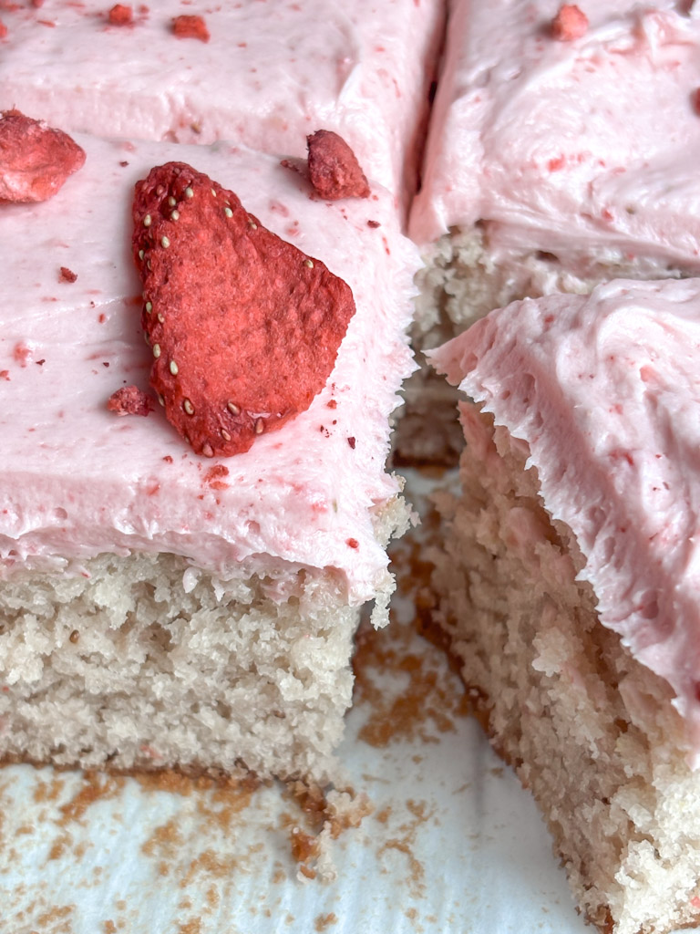 close up of sliced strawberry sheetcake