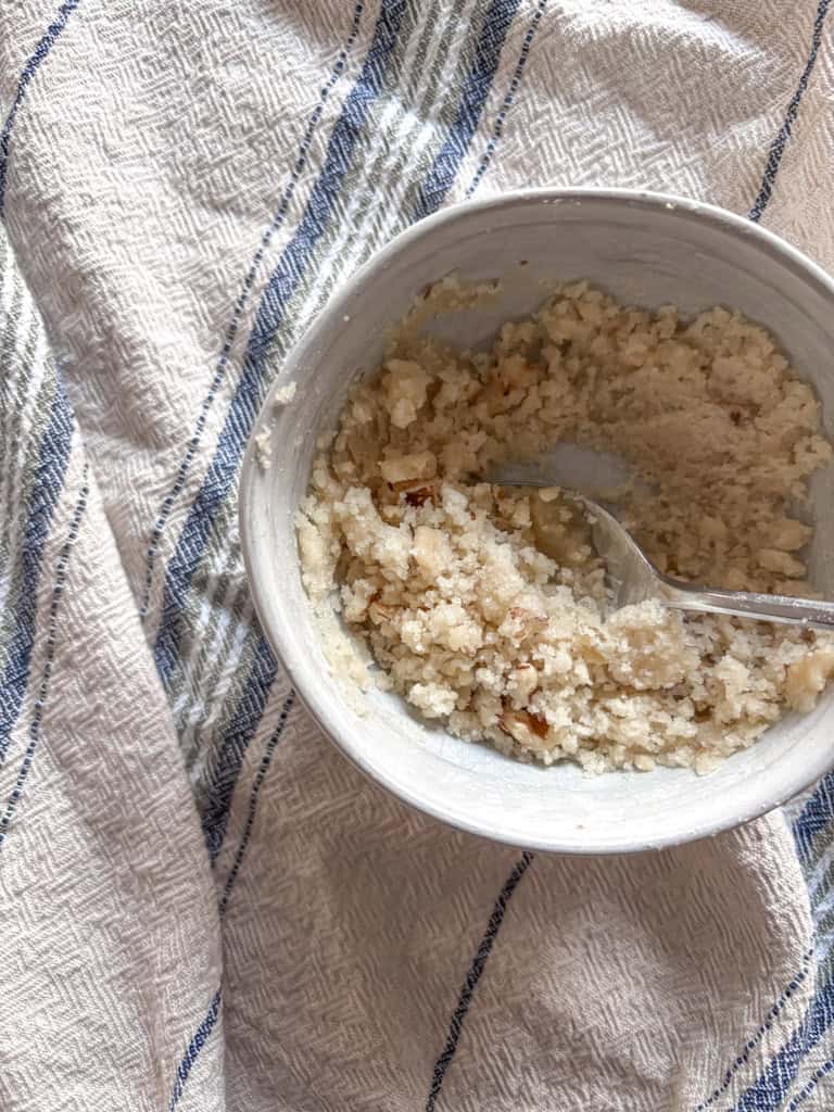 small bowl of walnut crumb topping