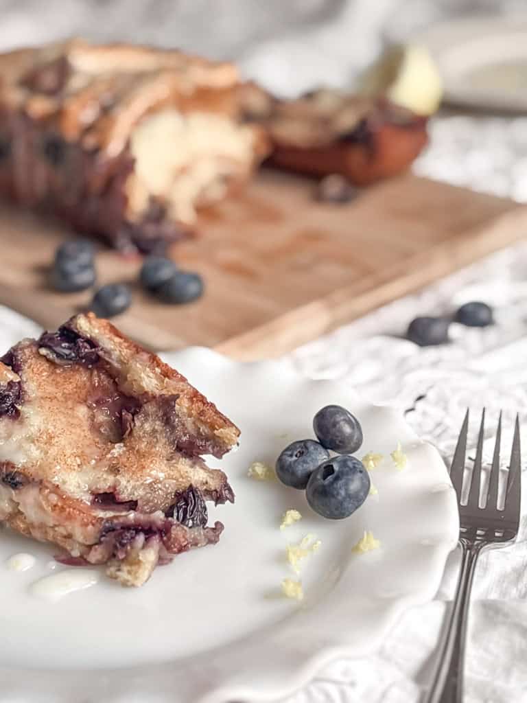 slice of sourdough blueberry bread on a plate 