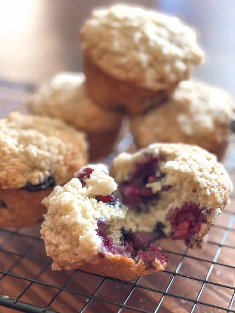 open blueberry muffin on a wire rack