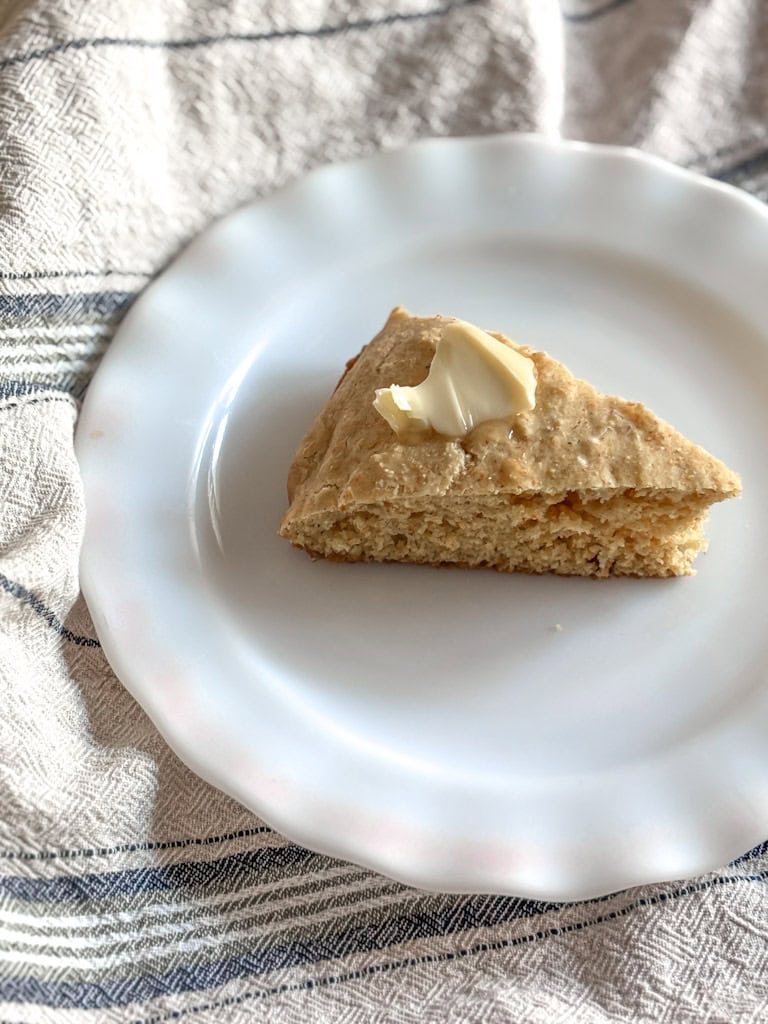 slice of sourdough cornbread with a dolop of butter on top