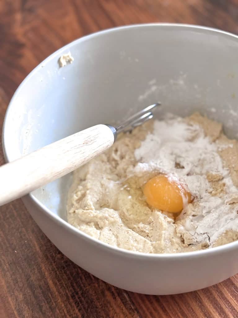 mixing bowl with sourdough cornbread batter being mixed