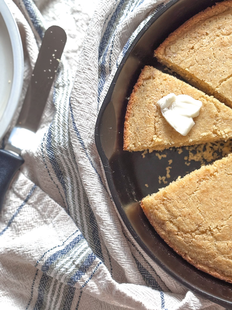 clost up of a cast iron skillet with cornbread 