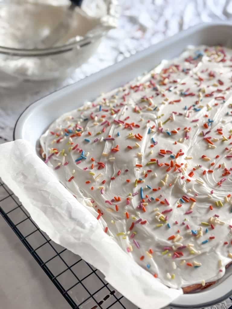 top view of a birthday sheet cake with sprinkles