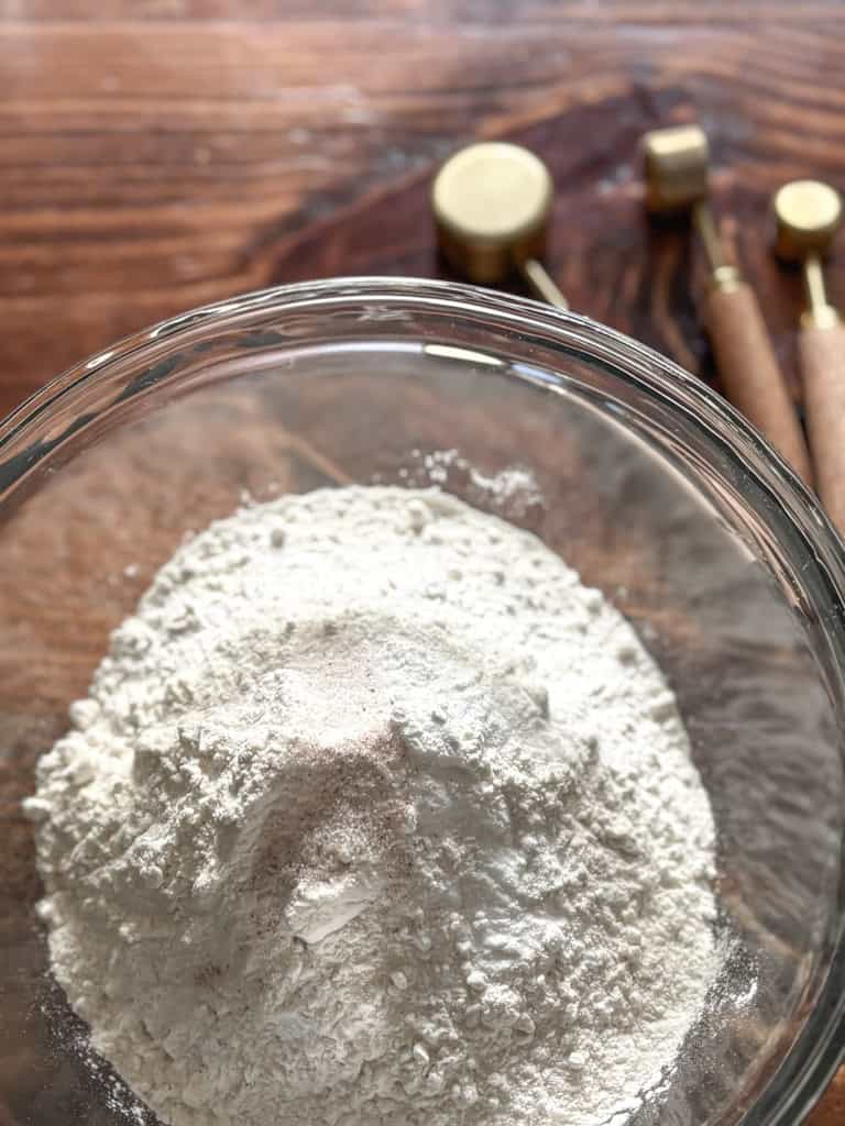 clear bowl with dry cake ingredients
