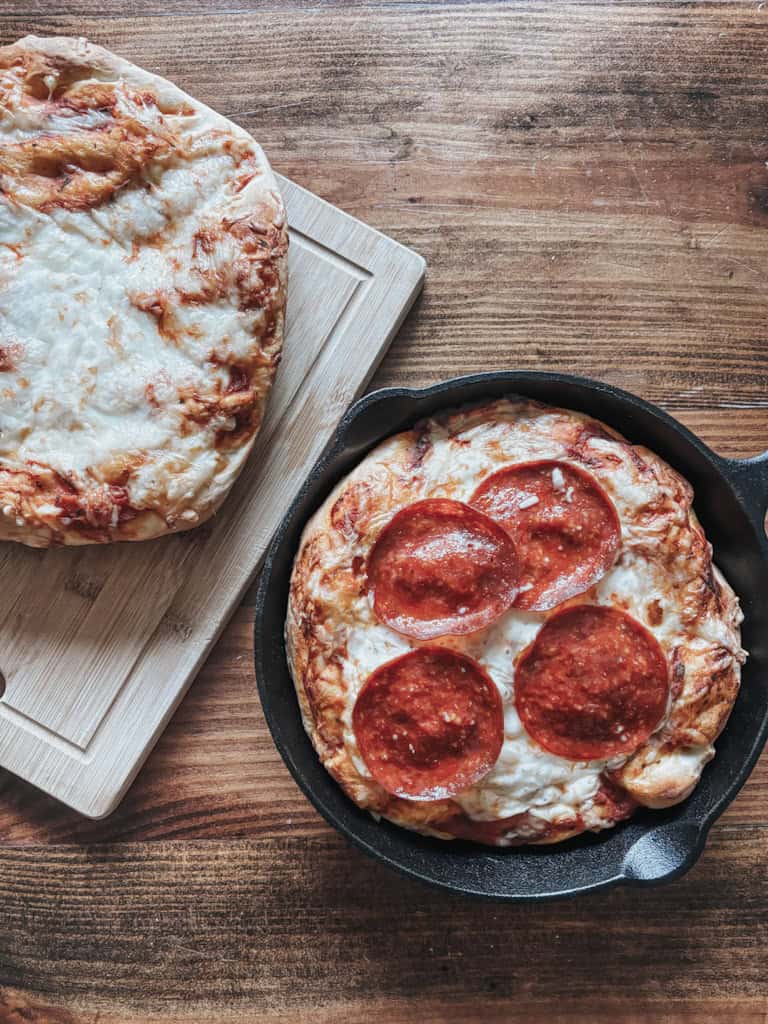 top view of deep dish pepperoni pizza in a cast iron skillet