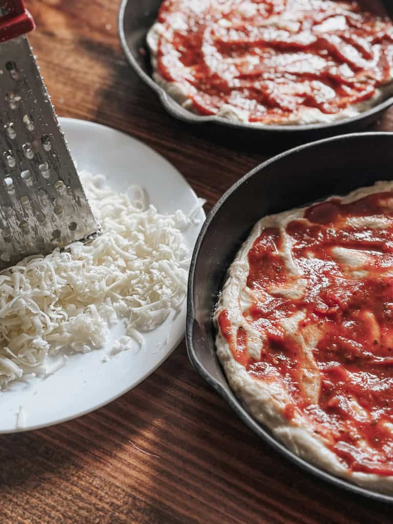 prepping deep dish pizzas