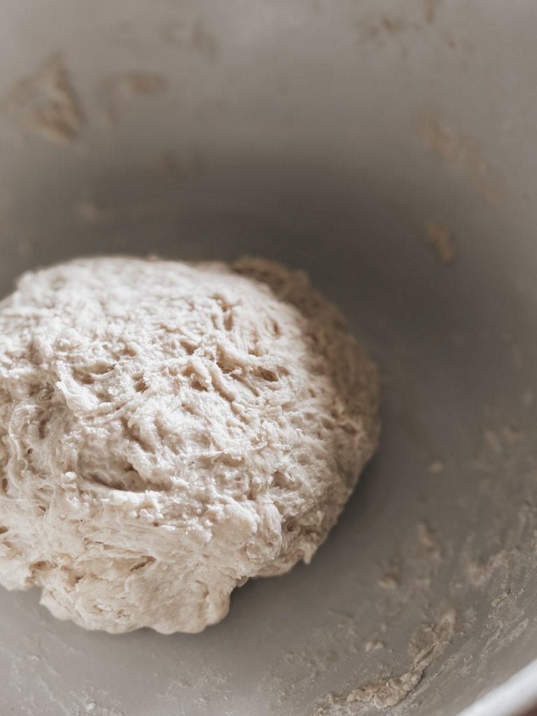 close up of pizza dough inside a bowl