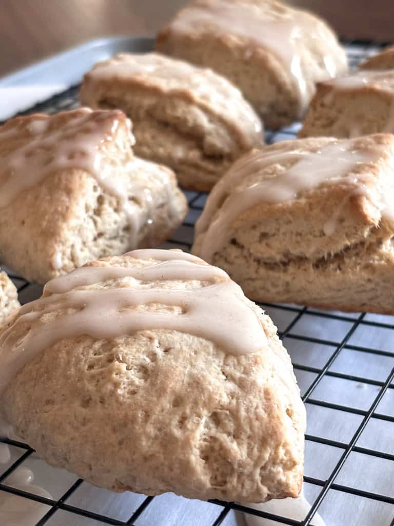 close up of cinnamon biscuits on a wire rack