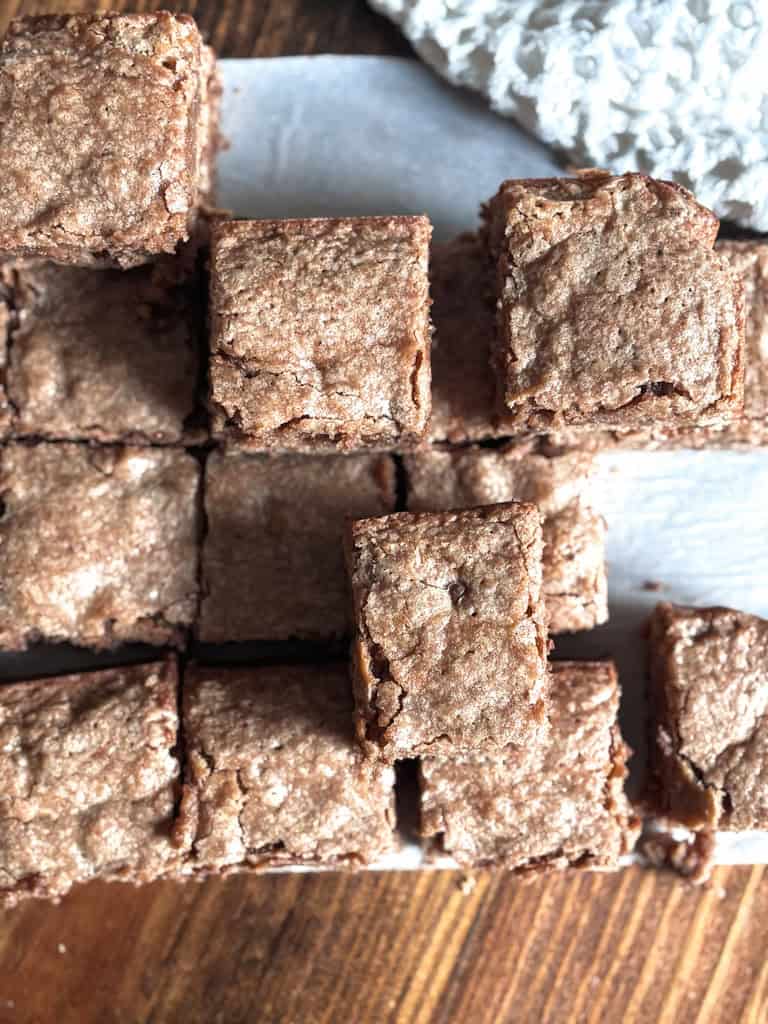 top view of sourdough discard brownies cut into squares on a table