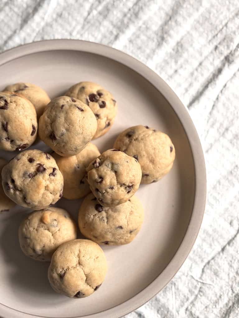 close up of top view of chocolate chip cookie bies on a plate