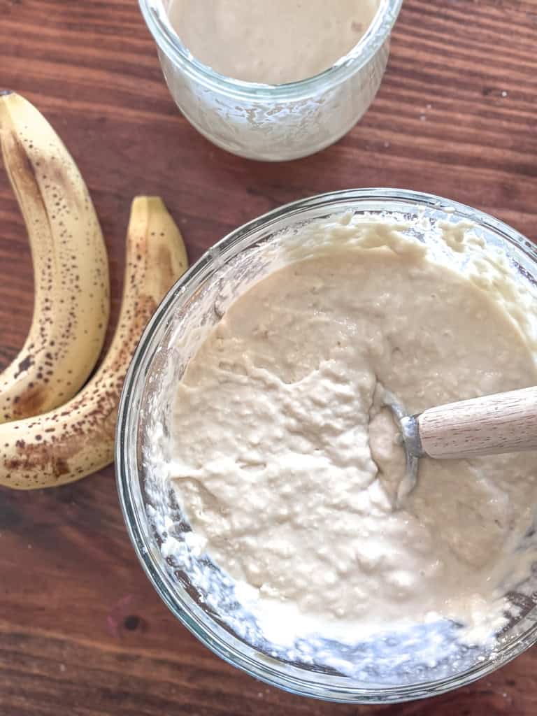 bannanas beside a bowl full of pancake batter