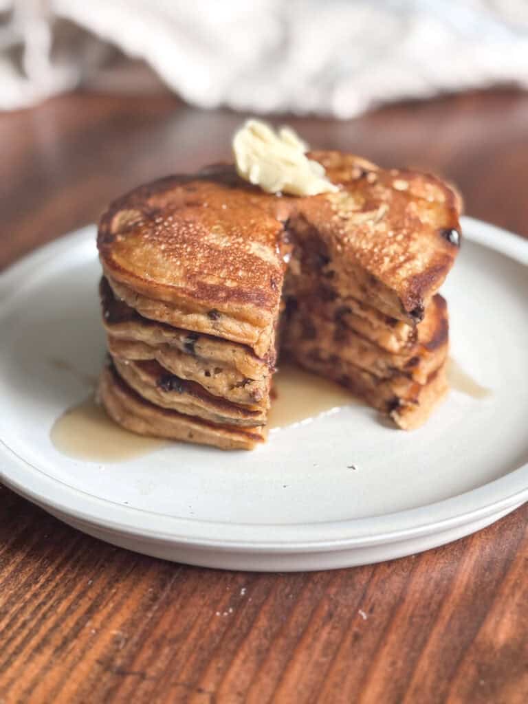 plate stacked with pumpkin sourdough pancakes